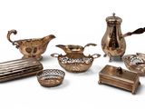 an assortment of silver plated items including a teapot, tray, and other items
