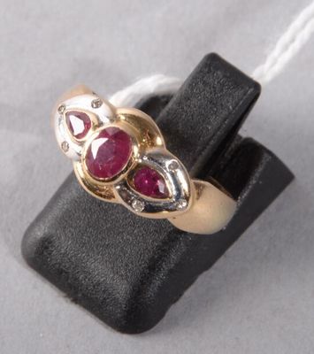 an image of a gold ring with two ruby stones