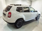 a picture of a white dacia parked in a garage