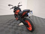 an image of a motorcycle parked on a checkered floor