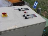 a white box sitting on top of a pile of junk