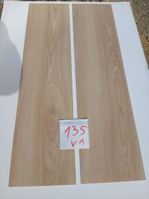 a close up of a piece of wood with a price tag on it