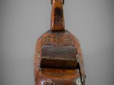 an old wooden box with a handle on a gray background