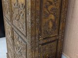 a wooden cabinet that has a clock on top of it