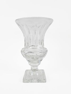 a clear glass vase sitting on top of a table
