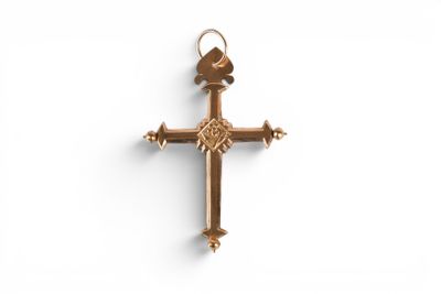 a close up of a cross on a white surface