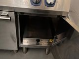 a large stainless steel oven with two burners in it