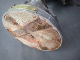 a close up of a metal object with a cross on it