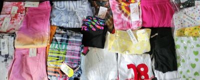 many different types of underwear on a bed