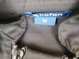 the zippers on the bottom of a gray jacket are closed