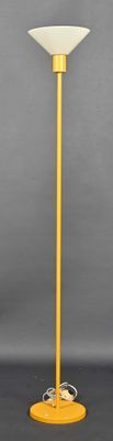 yellow table lamp with a white shade on top of it
