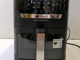 an air fryer with a digital clock on it