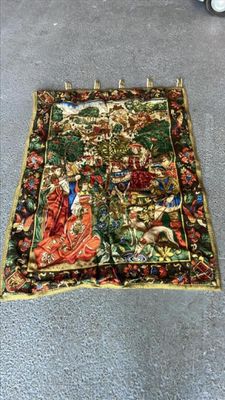 a rug on the floor that has a picture of a man and a woman on it