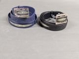 pair of men ' s leather belts with silver buckles on a white background