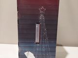 the box is open to show the contents of a christmas tree