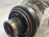 a close up of a metal object on a white surface