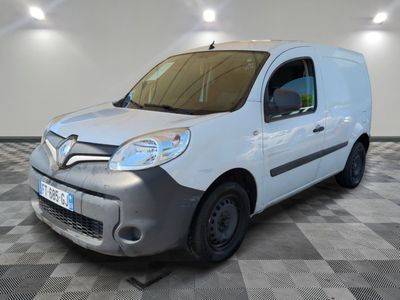 the white van is parked on a checkered floor in a room