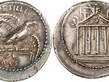a silver coin with a bird on top of it