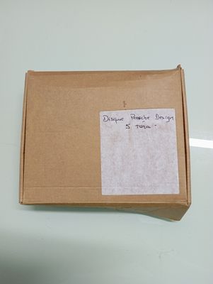 a brown box with a piece of paper on top of it