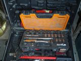 a tool case with tools in it sitting on the floor