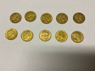 a bunch of gold coins sitting on top of a white table