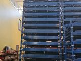 a large stack of pallets in a warehouse