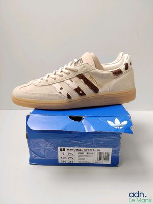 a pair of adidas sneakers are sitting on top of a box