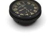 a black clock on a white surface with a white background