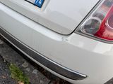 a white car parked on the side of the street