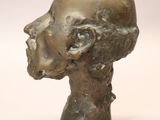 an image of a bronze sculpture of a man ' s head on a white background