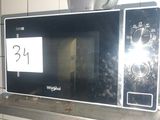 a microwave sitting on top of a counter in a kitchen
