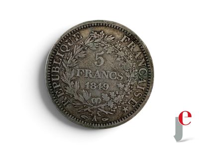 a close up of a coin on a white surface