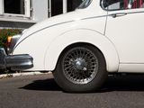a white car that is parked in front of a house