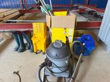 a vacuum that is sitting on the floor in a room