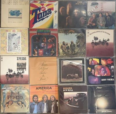 a lot of albums and cds on the wall