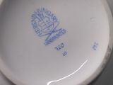 a close up view of a tea cup and saucer on a table