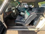 a picture of the inside of a car with the door open