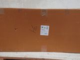 a cardboard box sitting on top of a wooden table