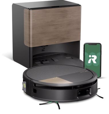 an image of a robotic vacuum cleaner with a phone next to it