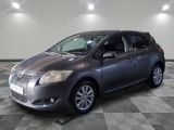 a picture of a grey toyota sienna parked in a garage