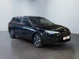 a black toyota rav parked in a white room