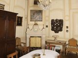 a dining room with a table and chairs and a chandelier