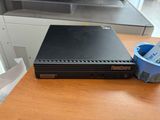 a black computer sitting on top of a wooden desk