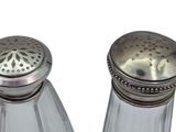 pair of salt and pepper shakers on a white background
