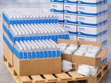 several boxes of water sitting on top of a wooden pallet