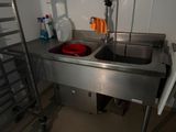 a sink and a towel rack in a small room