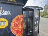 a vending machine that has a pizza on it