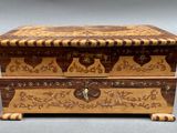 an image of a wooden box with carvings on it