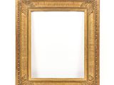 a gold frame with a decorative pattern and a white background