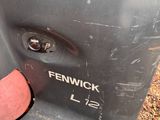 a close up of a dog ' s tongue sticking out of a seat on a scooter